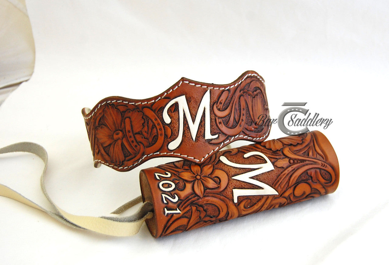 Custom hand tooled leather wedding garter belt pictured with custom bouquet wrap