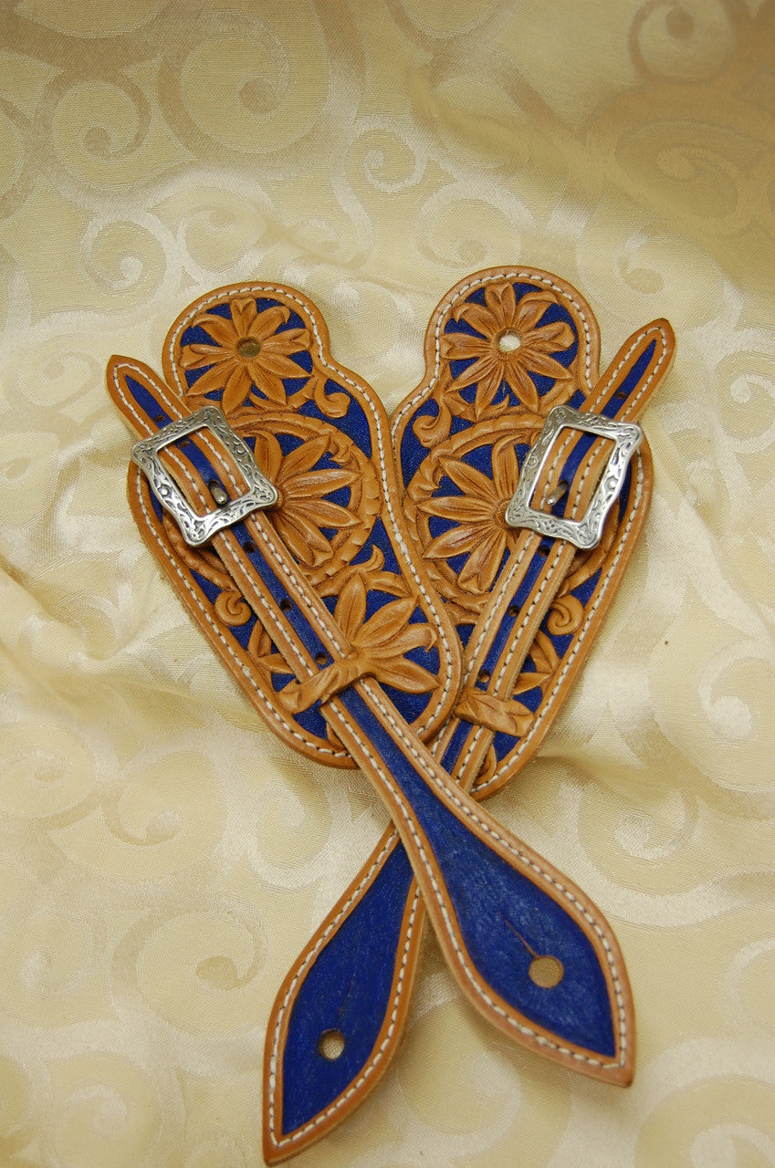 An example of the Visalia style spur strap hand tooled and painted with Horseshoe brand stainless steel hardware.